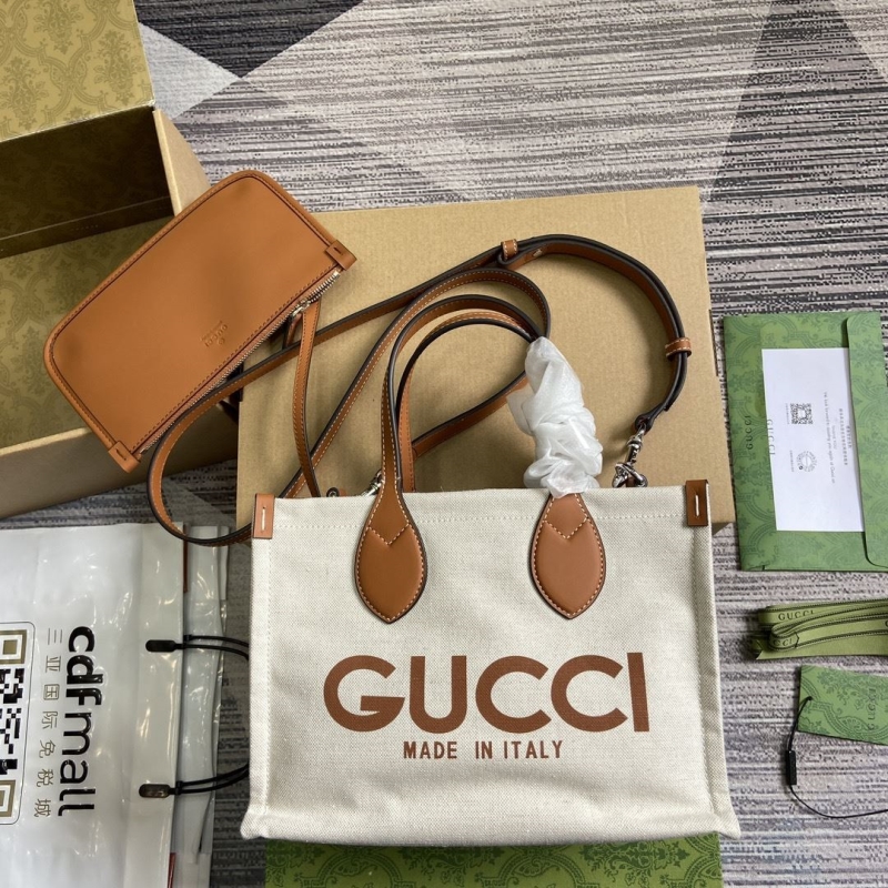 G*u*i shopping bags